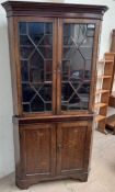 A 19th century oak and mahogany standing corner cupboard,