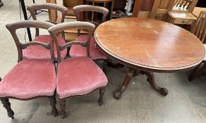 A Victorian mahogany supper table together with a set of four Victorian mahogany dining chairs