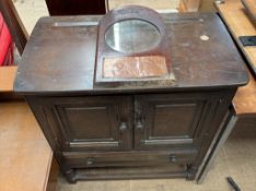 An oak side cabinet with a rectangular top,