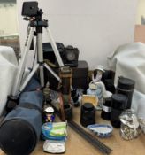 A Chinon CE-5 35mm camera together with a tripod, camera lenses, telescope, Lladro figure, pap boat,