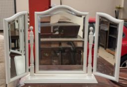 A cream tryptych dressing table mirror