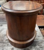 A Victorian mahogany commode stool with a circular hinged top enclosing a removable lid,