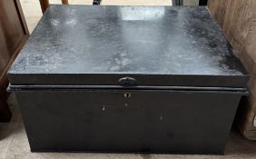 A black painted tin trunk