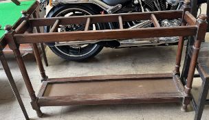 A Victorian mahogany five division umbrella stand of rectangular form on turned legs,