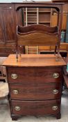 A 19th century mahogany chest with graduating drawers together with a mahogany magazine rack