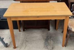 A modern melamine table with a rectangular top and four legs