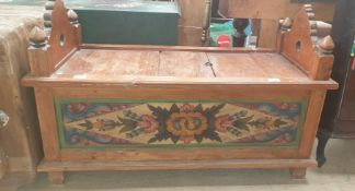 A continental carved and painted box settle with carved shaped ends,