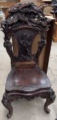 A Chinese dining chair carved with an eagle,