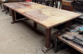 A Brynmawr oak refectory table with a rectangular planked top on cluster column legs united by