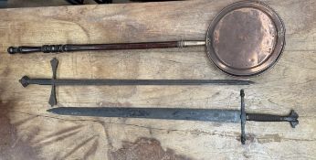 Two medieval style swords together with a copper bed warming pan
