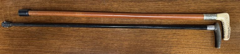 A silver topped and horn handled walking stick together with an antler handled walking stick
