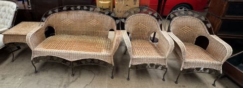 A conservatory suite comprising a three seater settee,