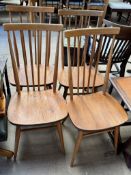 A set of four Ercol stick back chairs