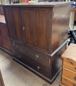 A 20th century mahogany side cabinet, the top with a pair of cupboard doors and drawers,