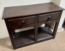 An oak dresser base with a rectangular top above two drawers and a pot board on square legs,