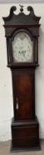 A 19th century oak long case clock with a broken swan neck pediment and reeded columns above a long