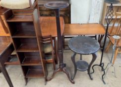 An Edwardian mahogany bookcase together with a mahogany torchere,