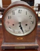 An Edwardian mahogany bracket clock with a silvered dial and Arabic numerals