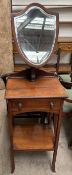 A 19th century mahogany gentleman's vanity table with a shield shaped mirror and single drawer in