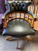 A green leather upholstered captains office chair