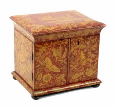 An attractive red and gilt chinoiserie lacquer small table sewing cabinet probably relating to the