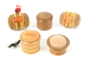Five whitewood paint and label decorated Tunbridge ware pin cushions, comprising two double ended