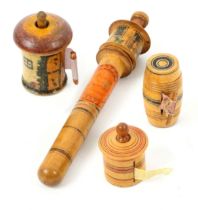 Three whitewood painted Tunbridge ware tape measures and a needle case, comprising a cottage form