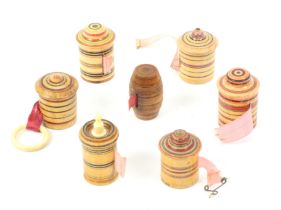 Seven whitewood paint decorated Tunbridge ware tape measures, six with ring painted decoration and