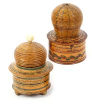 Two whitewood paint decorated Tunbridge ware bee skep pin cushions, one with circular box base