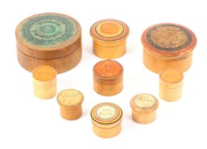 Nine whitewood label decorated Tunbridge ware and related circular boxes, comprising examples for