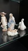Set of four NAO by Lladro porcelain figurines, including a girl with a parasol, Madonna and child,