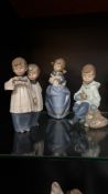 Set of four NAO by Lladro porcelain figurines, made in Spain. The figurines are depictions of