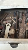 Vintage metal workshop drawers filled with assorted hand tools, including wrenches, files, saws, and