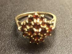 9ct Gold ring set with cluster of garnets Weight 3