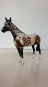 Beswick England ceramic horse figurine, hand-painted in an Appaloosa pattern with glossy finish.