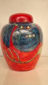 Large Poole Pottery lidded jar, England. Striking hand-painted design in vibrant red, blue, and