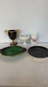 Mixed lot featuring a black and gold urn, ornamental white vase, hand-painted plates, and a signed