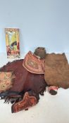 Western and Native American-themed lot, including a woven basket with a snakeskin accent, leather