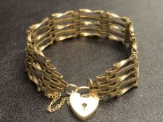9ct Gold gate bracelet with heart shaped locket &