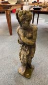 Stone garden statue depicting a lady