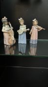 NAO by Lladró porcelain figurine trio, depicting young girls playing musical instruments, crafted in
