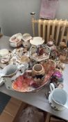 Exquisite vintage porcelain collection featuring floral patterns and elegant gilding. Includes