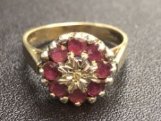 9ct Gold ring central diamonds surrounded by rubie