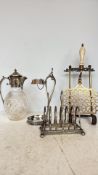 Antique Victorian brass footman trivet with pierced design and turned handle, from the late 19th