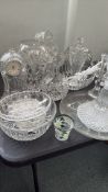 Cut glass collection includes clocks, bowls, and decanters with intricate patterns that enhance