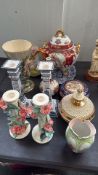 Porcelain collection includes vases, tureen, Delft candlesticks, and floral accents with vibrant