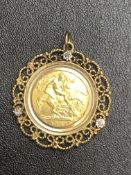 1982 Half sovereign in a 9ct gold mount set with 3 diamonds. Total weight 7.3g