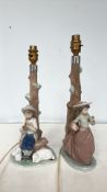 Pair of Nao by Lladró porcelain table lamps, depicting a young shepherd and a girl with a basket,