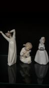 Set of three porcelain figurines, each depicting elegant, sentimental scenes. Glazed finish with
