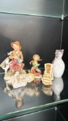 Collection of vintage porcelain figurines, including a seated old man with dog, a young boy with